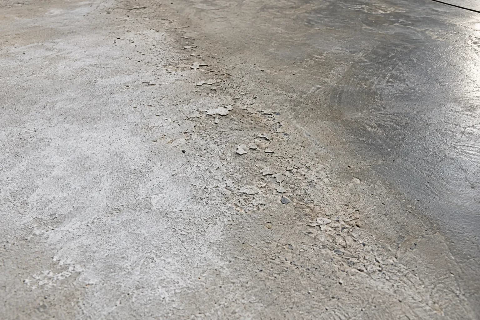 Concrete surface with dusting, scaling and trowel-burn defects